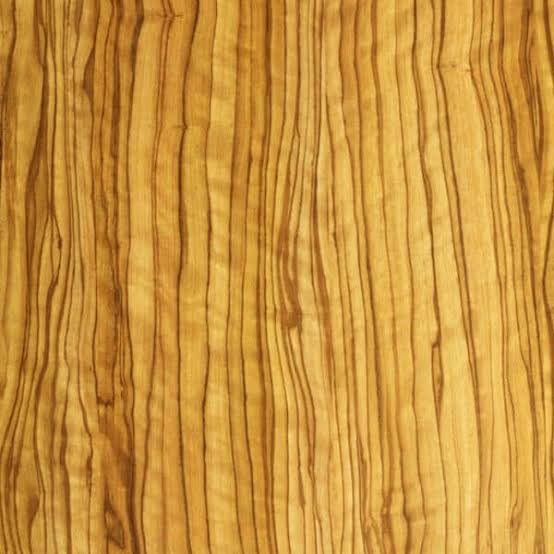 Campione ravvicinato di texture in pregiato legno di ulivo, caratterizzato dalle inconfondibili venature scure e ondulate su fondo dorato, utilizzato come opzione nel configuratore di tavoli.
